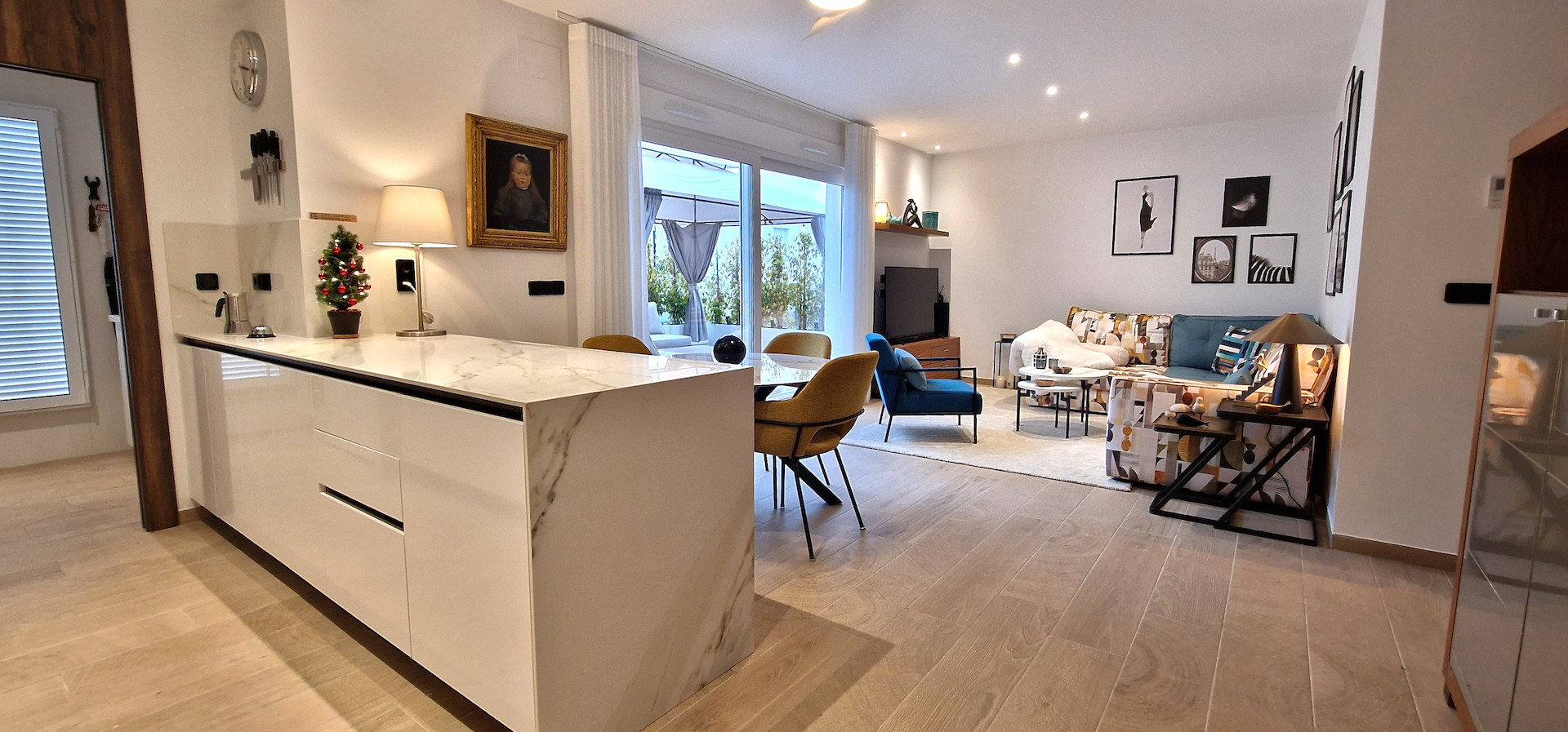 Modern and stylish, this partly furnished three-bedroom top-floor apartment with private solarium is