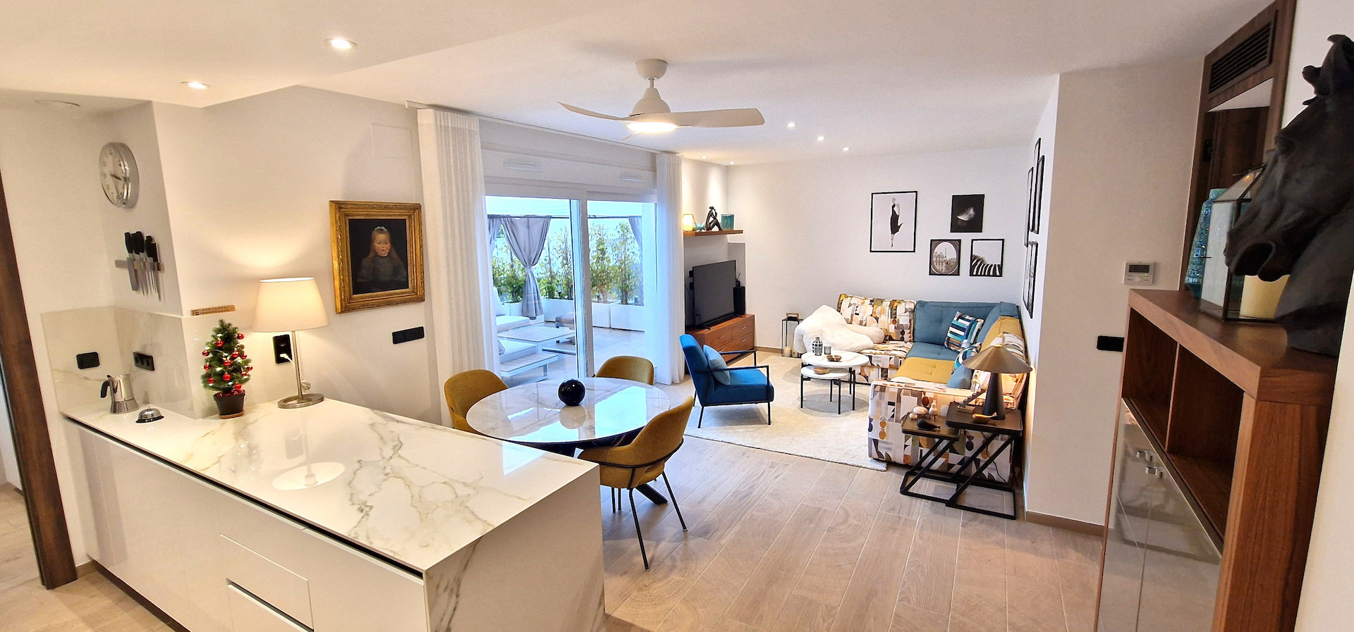 Modern and stylish, this partly furnished three-bedroom top-floor apartment with private solarium is