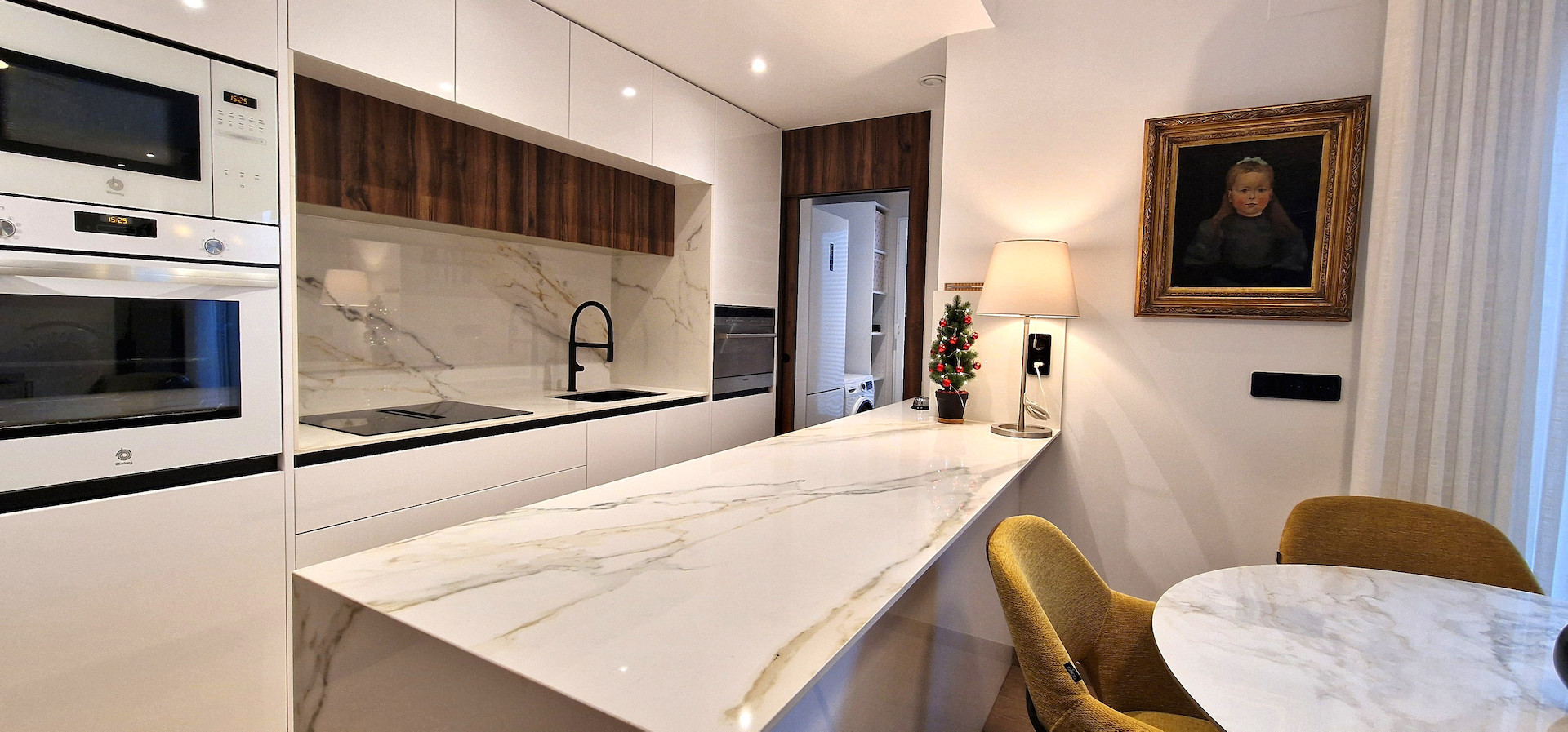 Modern and stylish, this partly furnished three-bedroom top-floor apartment with private solarium is